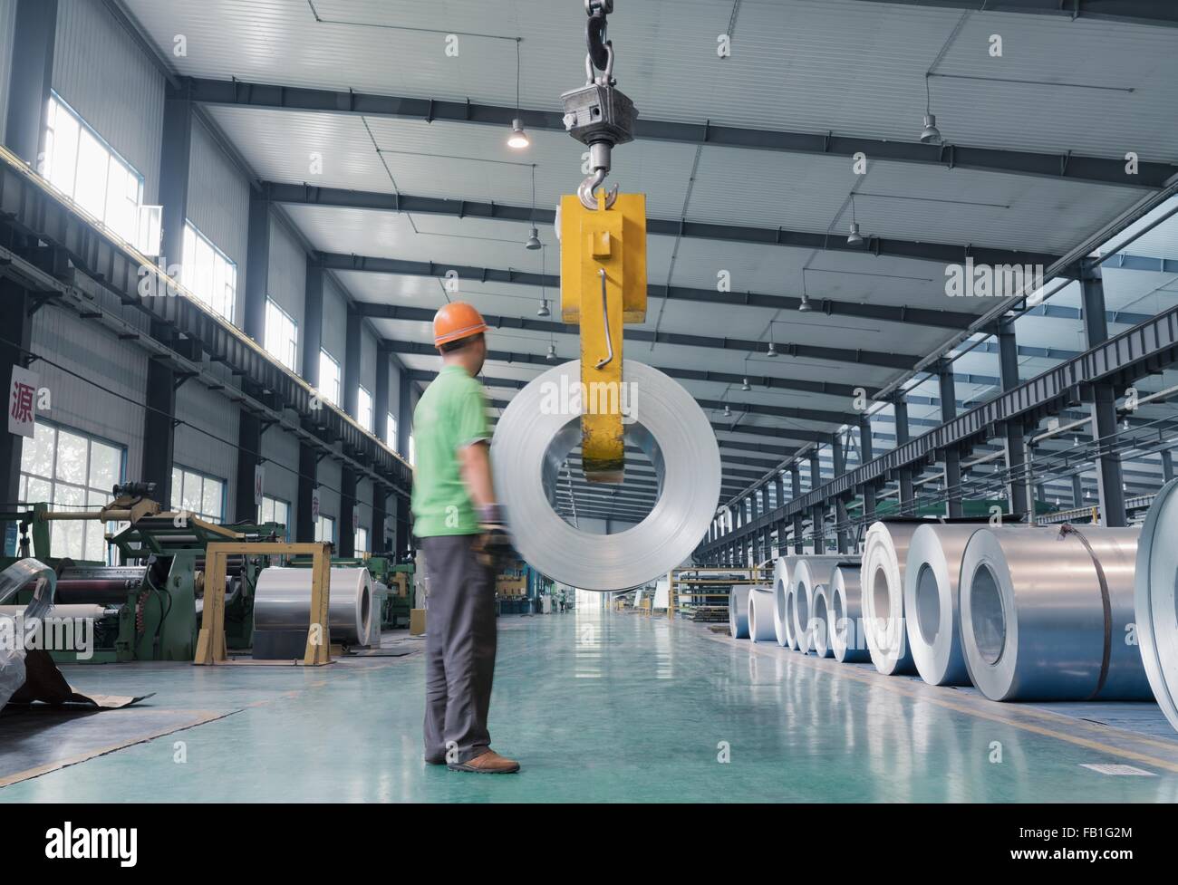 Worker in solar panel assembly factory, Solar Valley, Dezhou, China Stock Photo