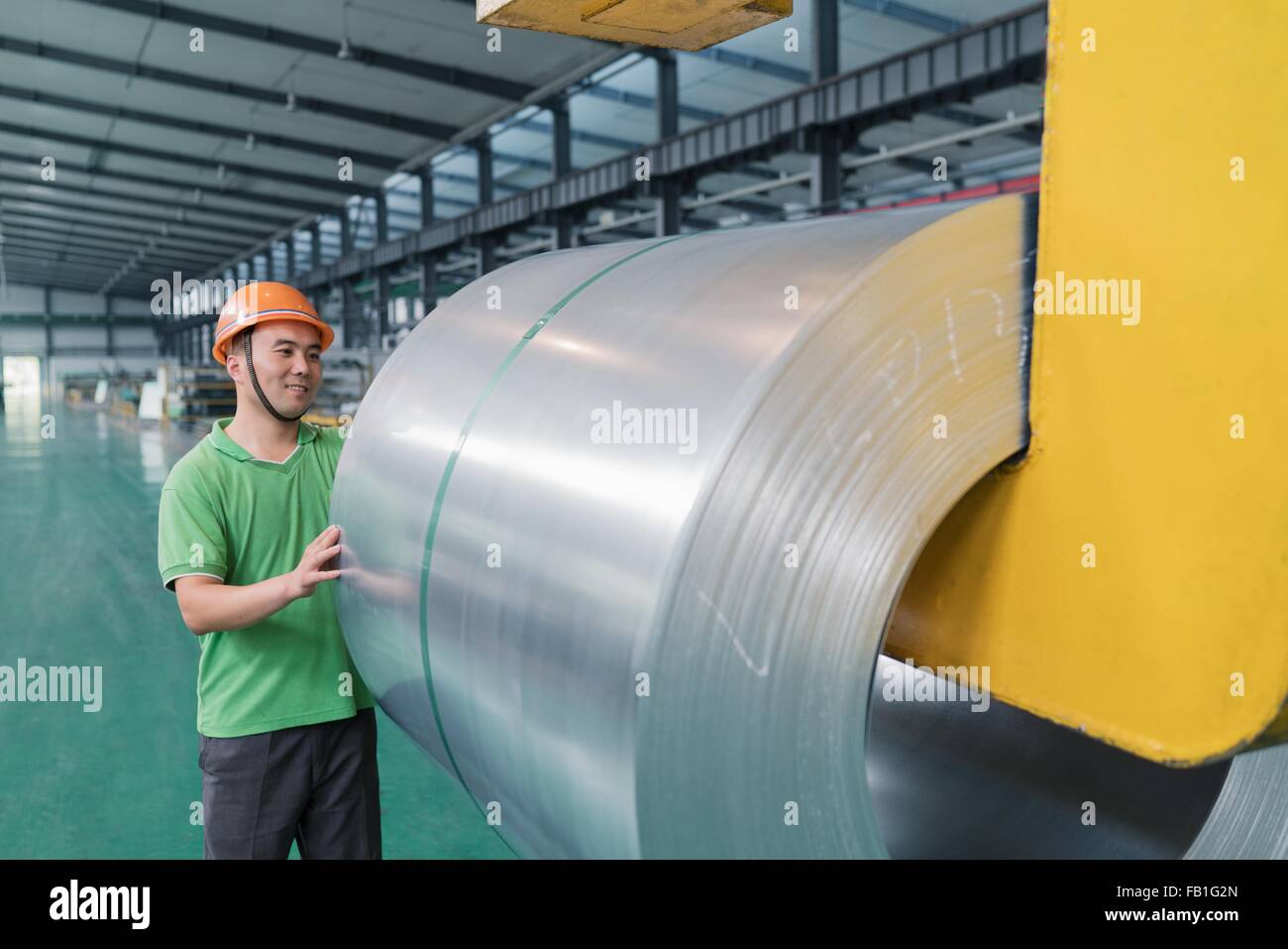 Worker in solar panel assembly factory, Solar Valley, Dezhou, China