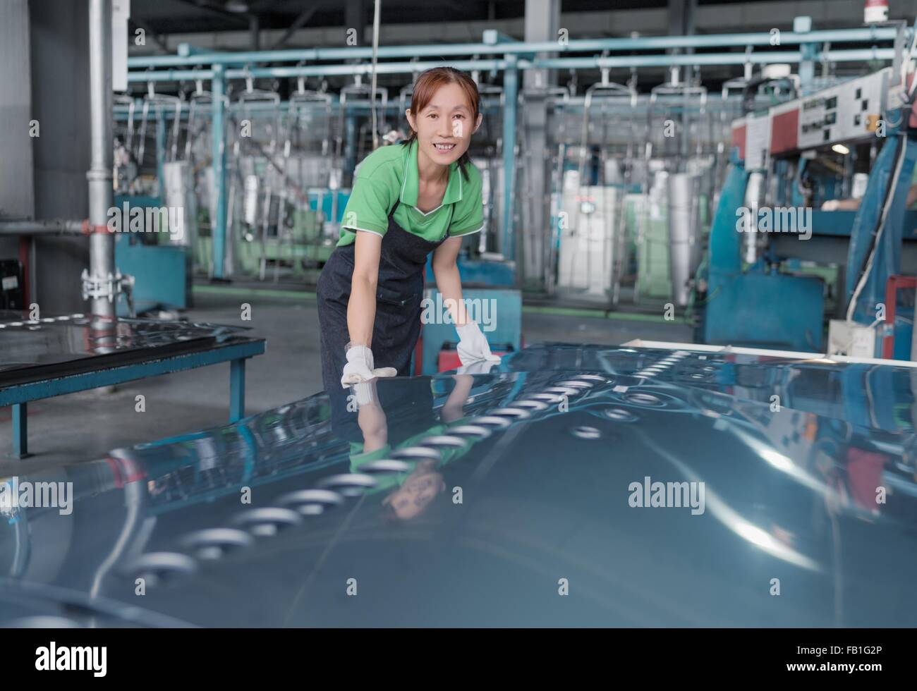 Worker in solar panel assembly factory, Solar Valley, Dezhou, China Stock Photo