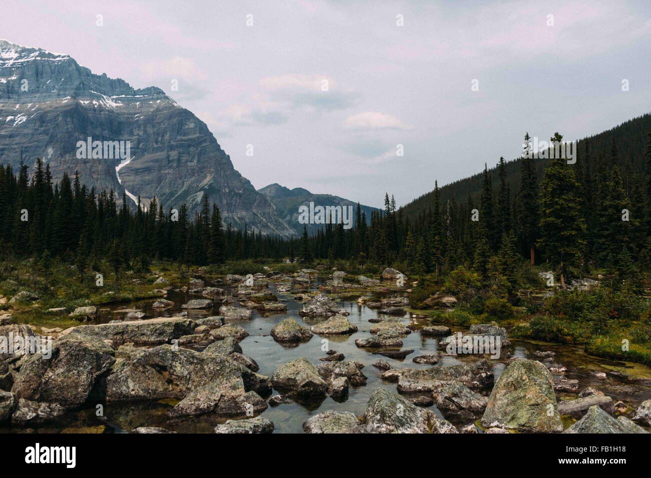 Rocky riverbed and mountain range, Moraine lake, Banff National Park, Alberta Canada Stock Photo