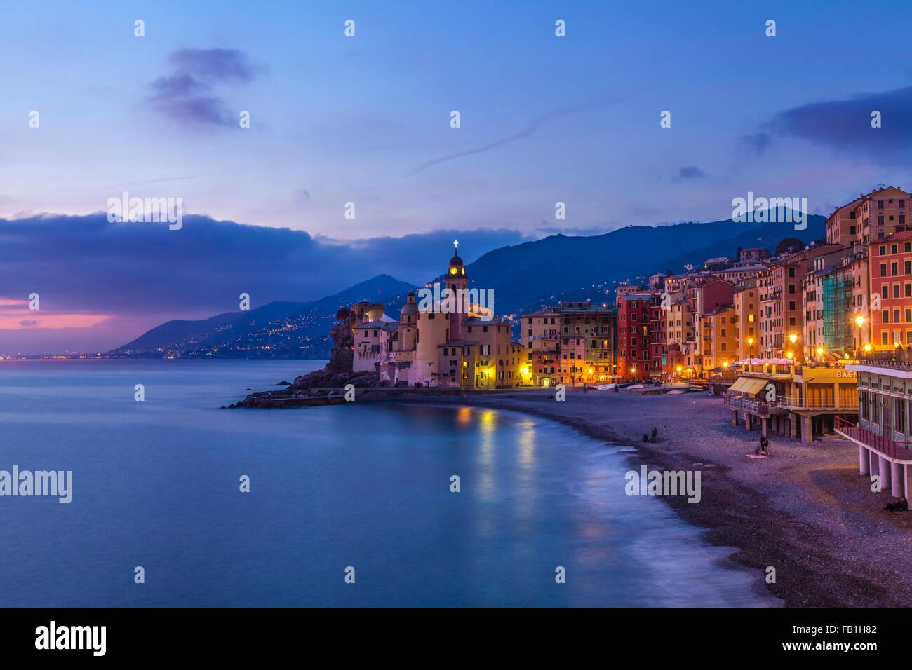 View of beach and hotels at dusk, Camogli, Liguria,  Italy Stock Photo