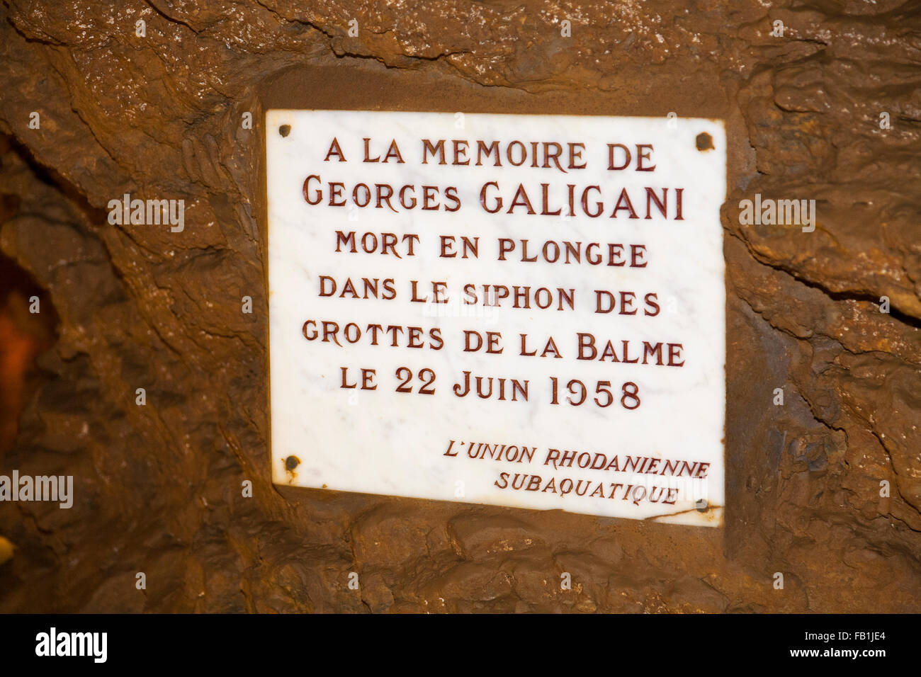 Memorial plaque to a pot holer / diver who died in a syphon in Caves of La  Balme, La Balme-les-Grottes, Isère department. France Stock Photo - Alamy
