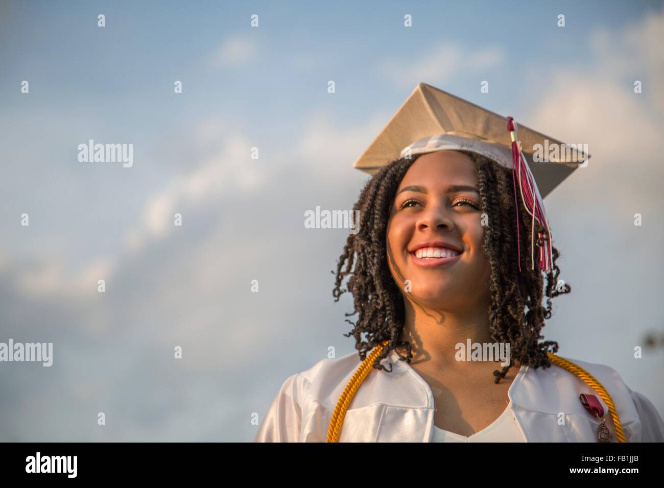 Portrait of happy teenage girl at graduation ceremony Stock Photo