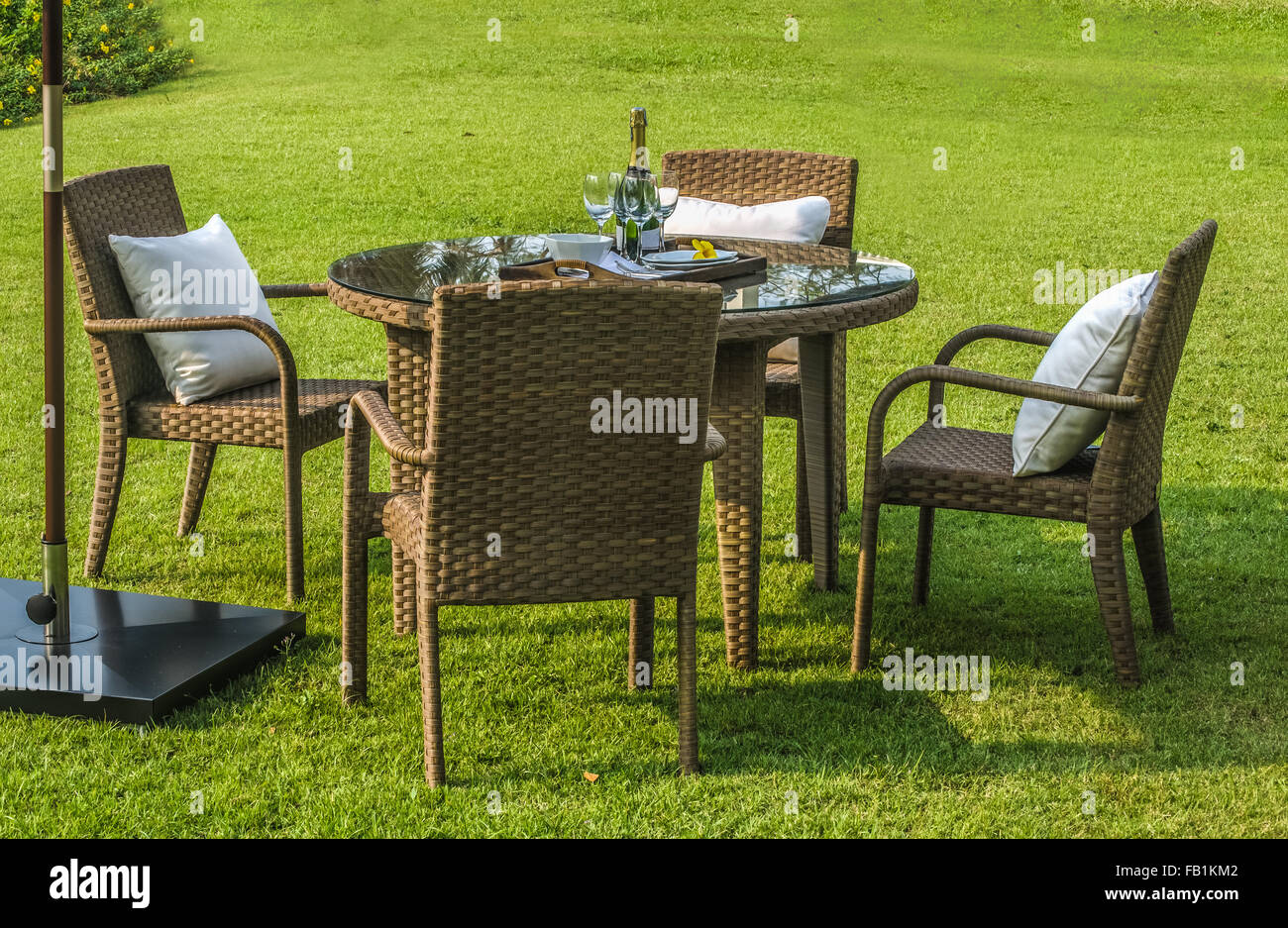 Rattan furniture, table and chairs outdoors Stock Photo