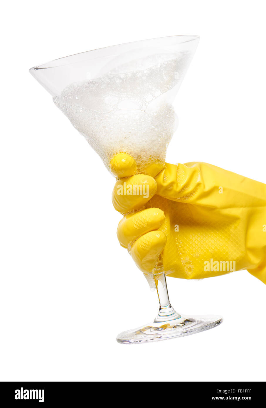 Close up of female hand in yellow protective rubber glove holding clean ...