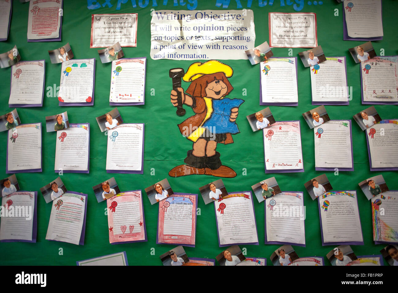 A bulletin board in a San Clemente, CA, third grade classroom exhibits examples of student written opinion pieces involving supporting text and a clear point of view. Note humorous illustration and portrait photos of students accompanying writings. Stock Photo
