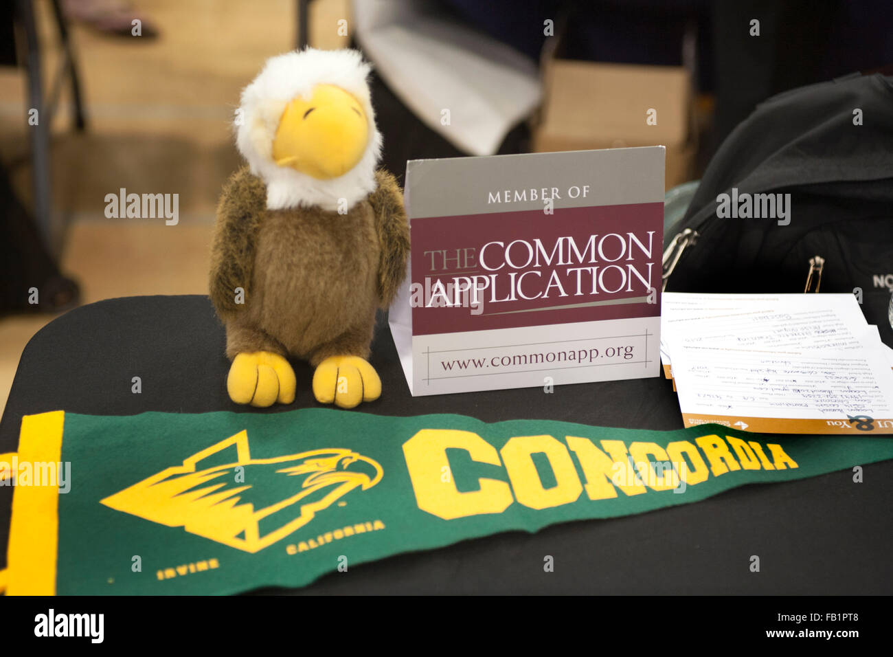 Concordia College in Irvine, CA, advertises it accepts the Common Application at a local college fair. The Common Application is an undergraduate college admission application that applicants may use to apply to any of 517 member colleges. Note pennant and mascot. Stock Photo