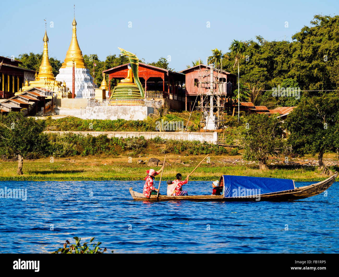 Boating along the lake-side village of Indawgyi Lake. Stock Photo