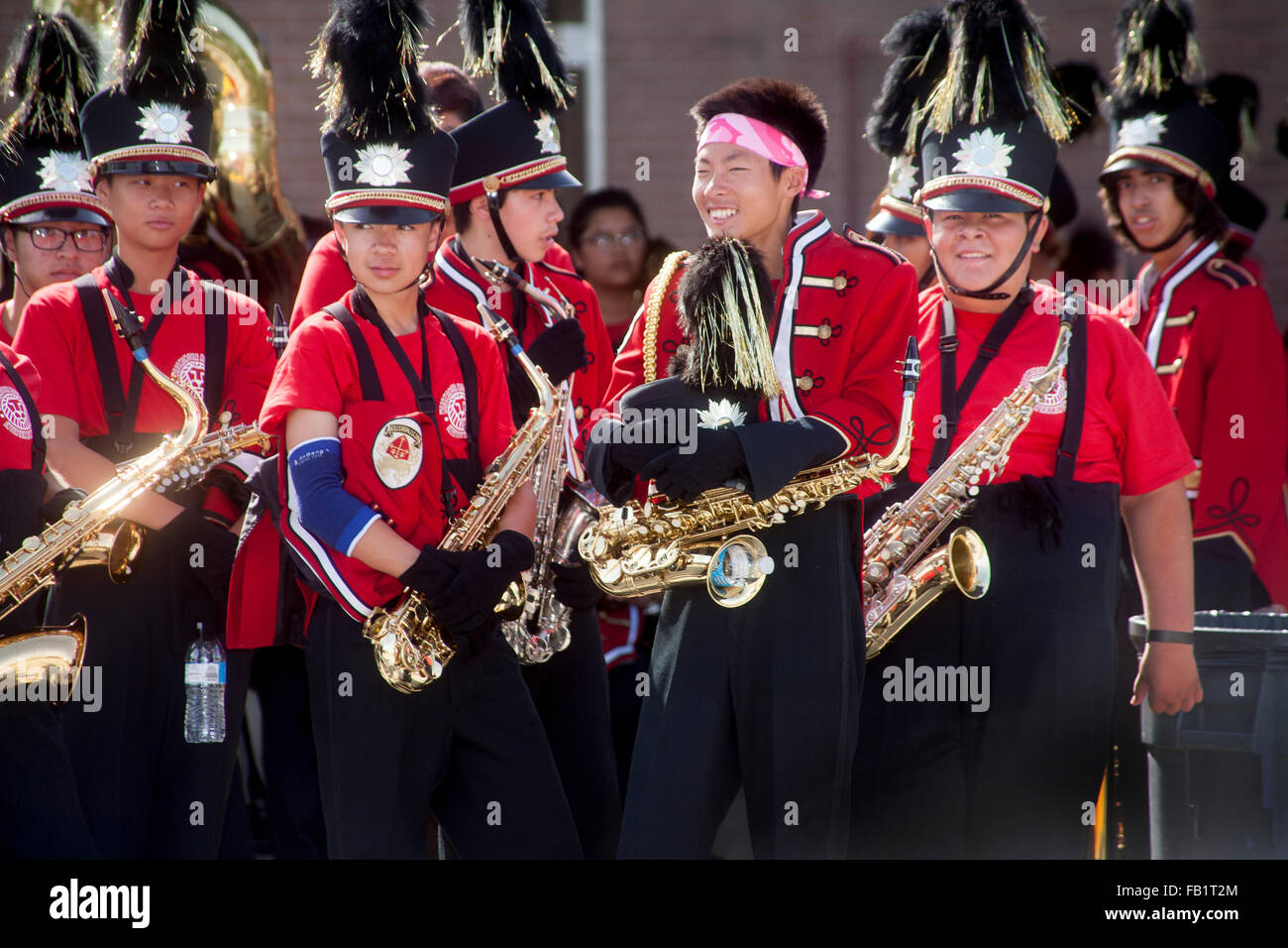 Uniformed Vietnamese American high school marching band saxophone