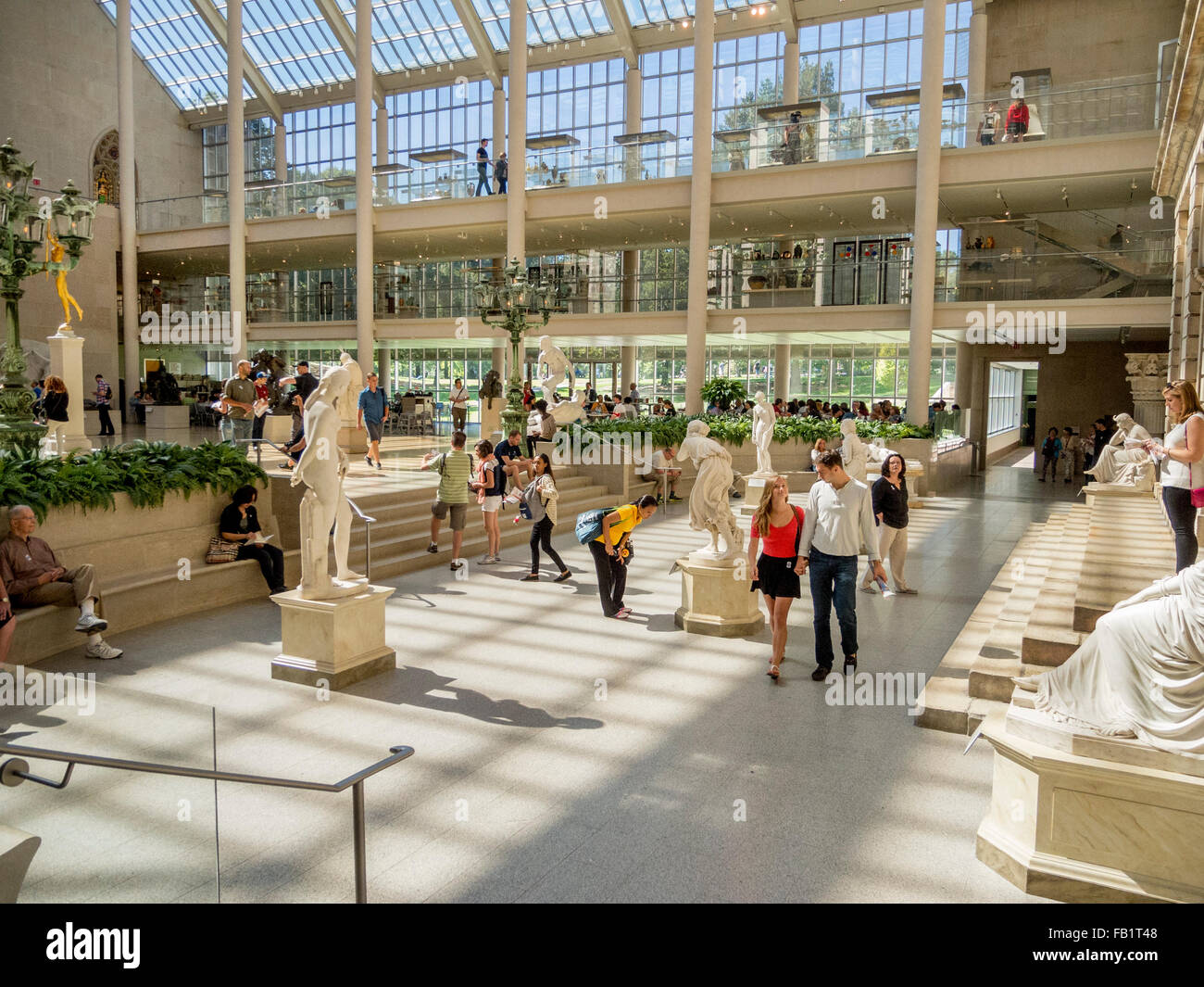 The Charles Engelhard Court in The American Wing of New York's Metropolitan Museum of Art is a glassed-in courtyard featuring large-scale American sculptures, stained-glass windows, and many other architectural elements. Stock Photo