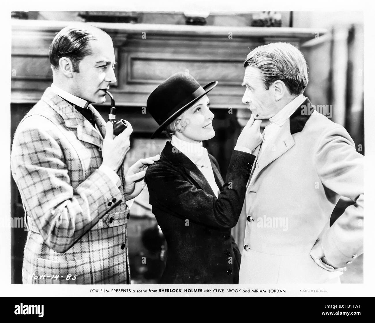 Still from 'Sherlock Holmes' 1932 film directed by William K. Howard and starring Clive Brook (Holmes); Miriam Jordan (Alice Faulkner) and Reginald Owen (Watson) Stock Photo
