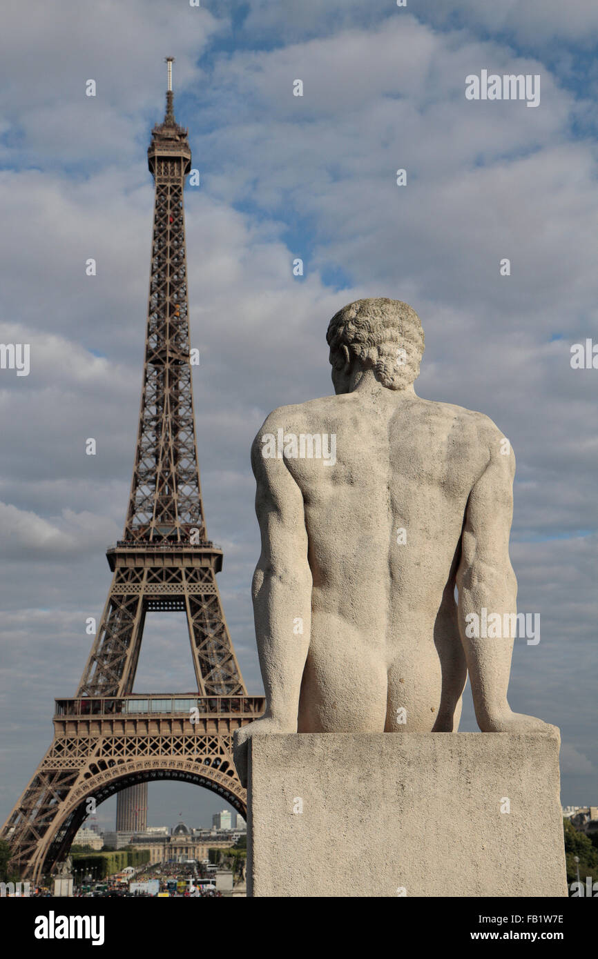 The 'L'Homme' (The Man) statue (by Pierre Traverse) and the Eiffel Tower, Paris, France. Stock Photo