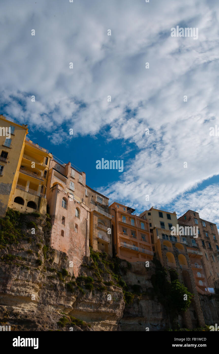 Colorful houses under blue sky with cloud sitting on cliff of Tropea coast Stock Photo