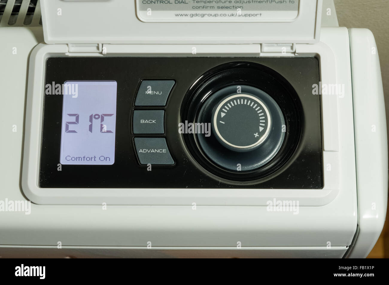 home central heating, electric storage heater radiator LCD display and temperature control panel set on 21 degrees celsius temperature Stock Photo