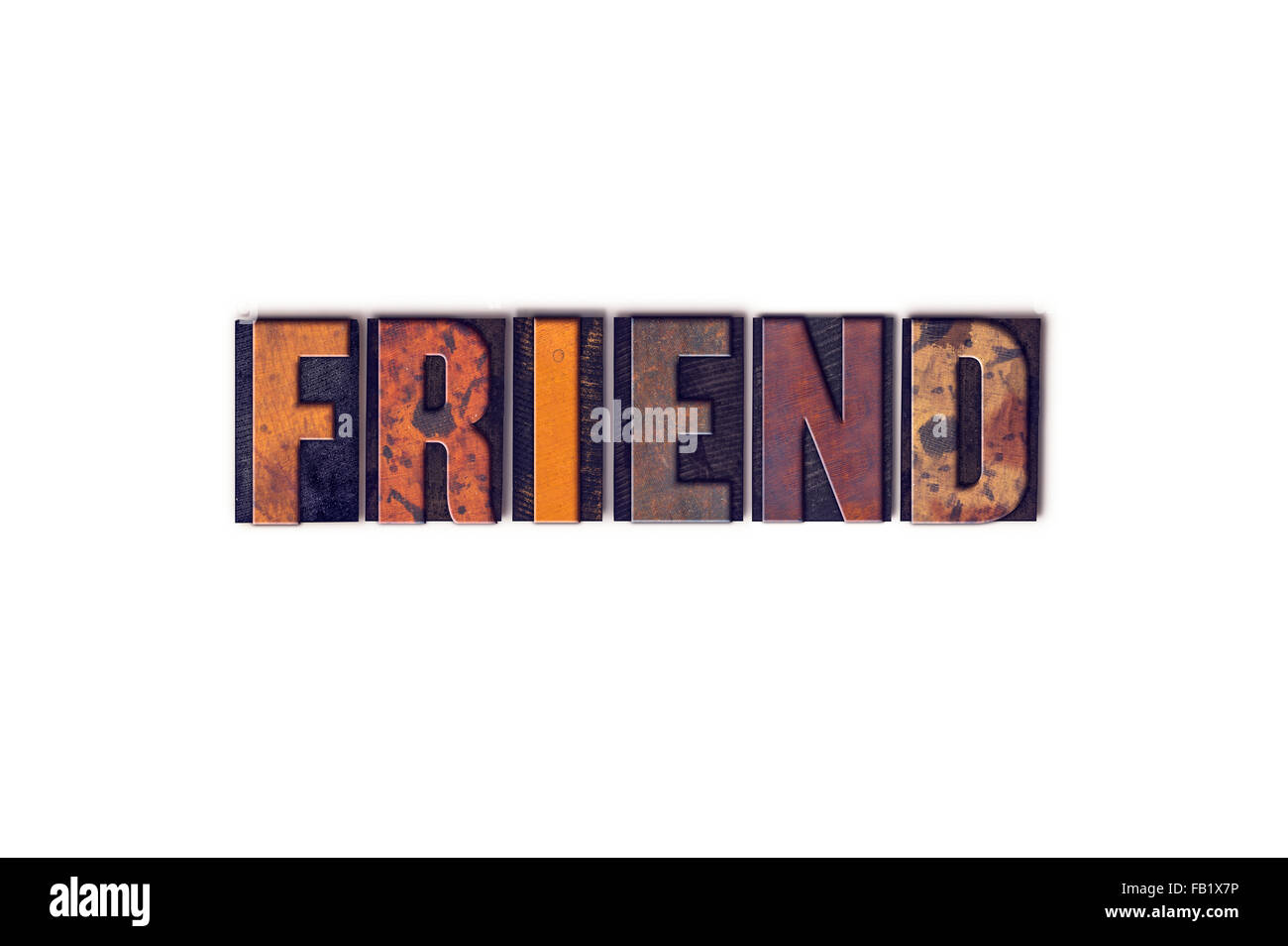The word 'Friend' written in isolated vintage wooden letterpress type on a white background. Stock Photo