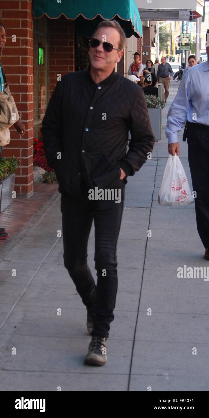 Kiefer Sutherland dressed all in black in skinny jeans and old scruffy  boots out running errands in Beverly Hills wearing aviator sunglasses  Featuring: Kiefer Sutherland Where: Los Angeles, California, United States  When: