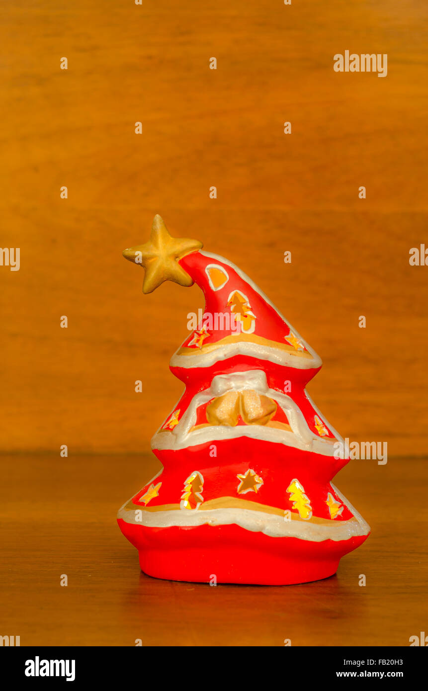 A softly glowing Christmas tree on a wooden background Stock Photo - Alamy