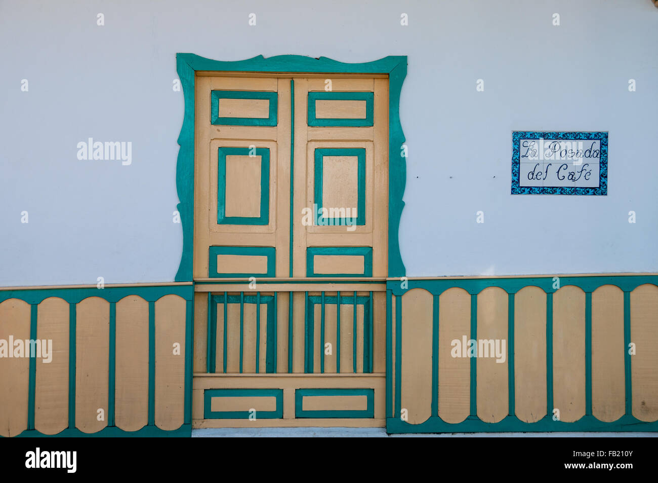 Yellow turquoise green wooden door of a colonial house front Stock ...