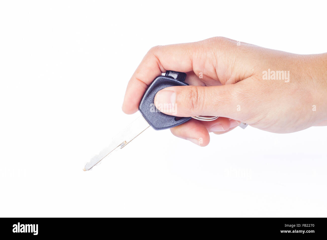 Hand with a car key isolated on white background, stock photo Stock ...