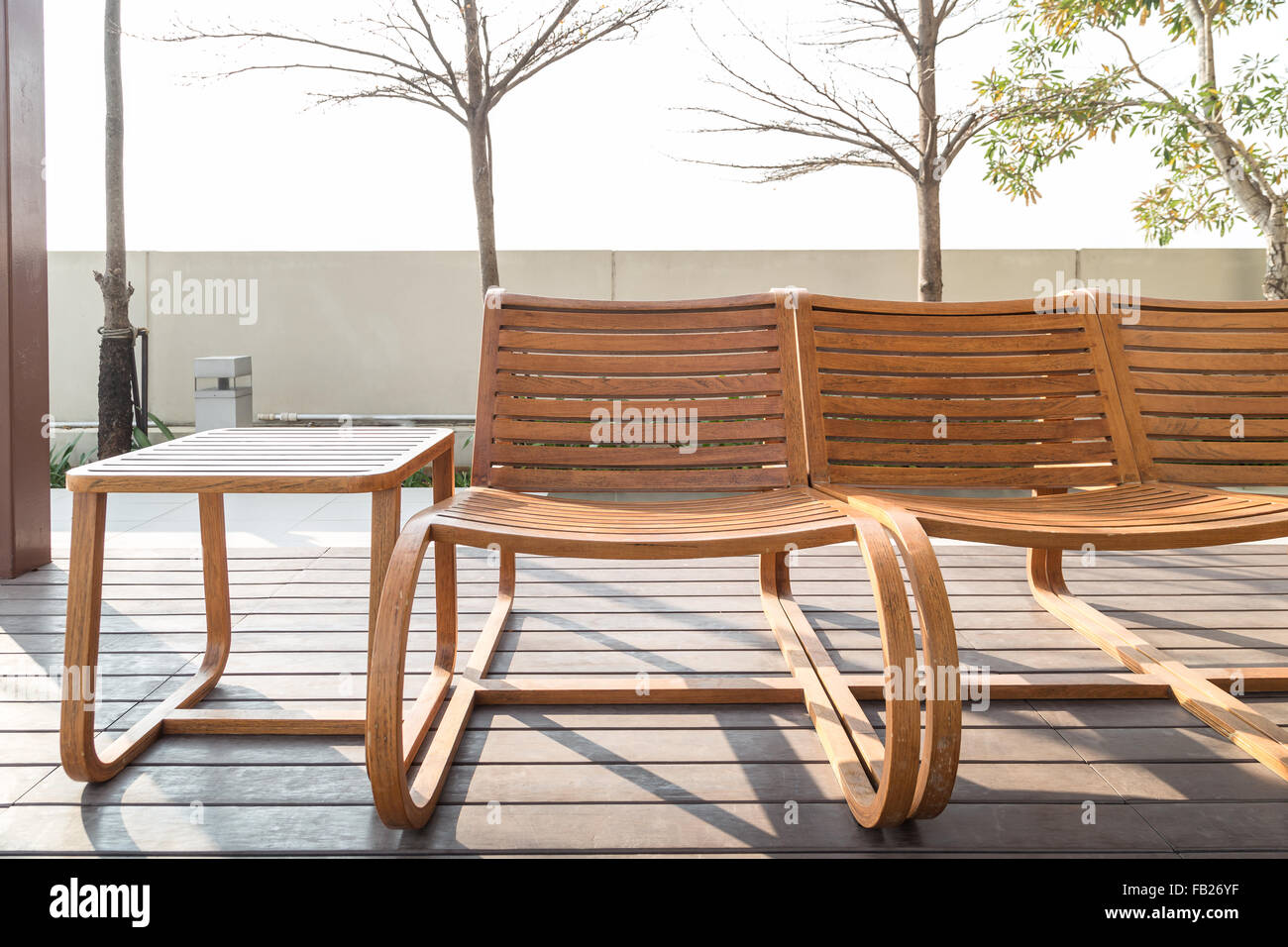 Brown Wooden Beach Chairs And Side Table On Wood Floor Near Swimming Pool Stock Photo Alamy