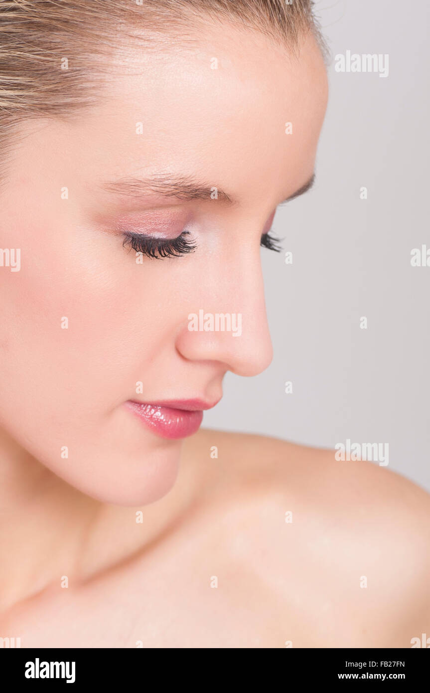Attractive young woman with pink eyeshadow eyes closed Stock Photo - Alamy