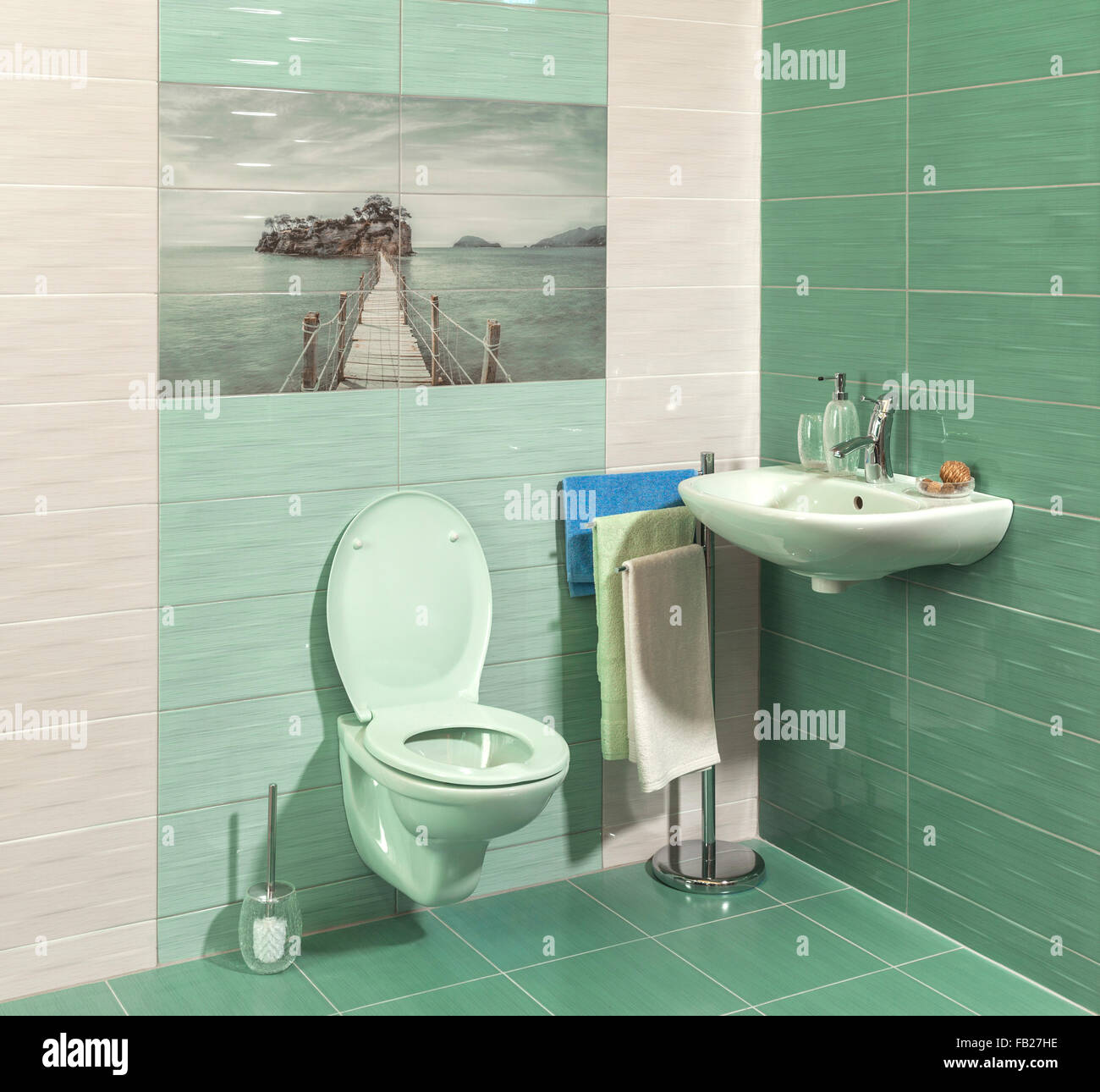 comfortable modern bathroom with green tiles Stock Photo