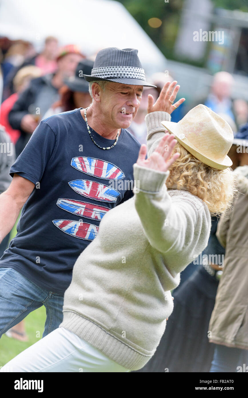 England, Surrey, Tilford. A mature couple dance to the music at the Weyfest music festival Stock Photo