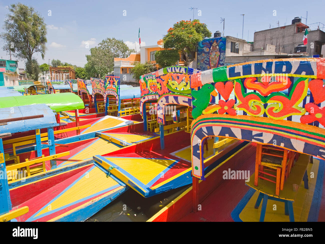 The colourful tourist boats on the canals of Xochimilco in Mexico City, Mexico, South America Stock Photo