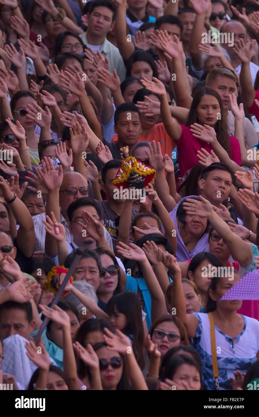 Cebu City,Philippines 08/01/2016. A Roman Catholic Solemn Mass held in the  Basilica Minore del St.Nino on the second day of the Fiesta Señor (Sinulog). A nine day religious festival honouring the Santo Nino De Cebu (Holy Child of Cebu). Many devotees bring with them a Santo Nino figurine representing the Child Jesus. Stock Photo
