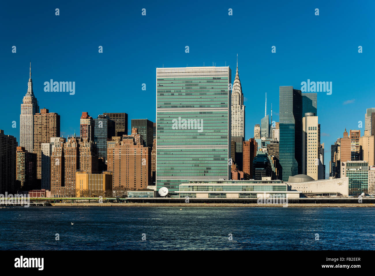 Manhattan skyline with the Headquarters of the United Nations, Empire State Building and Chrysler Building, New York, USA Stock Photo