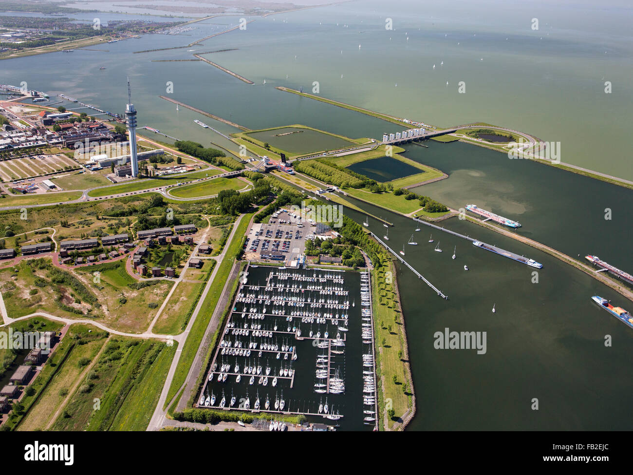 Netherlands, Lelystad, Broadcasting tower, locks, marina, aerial Stock Photo