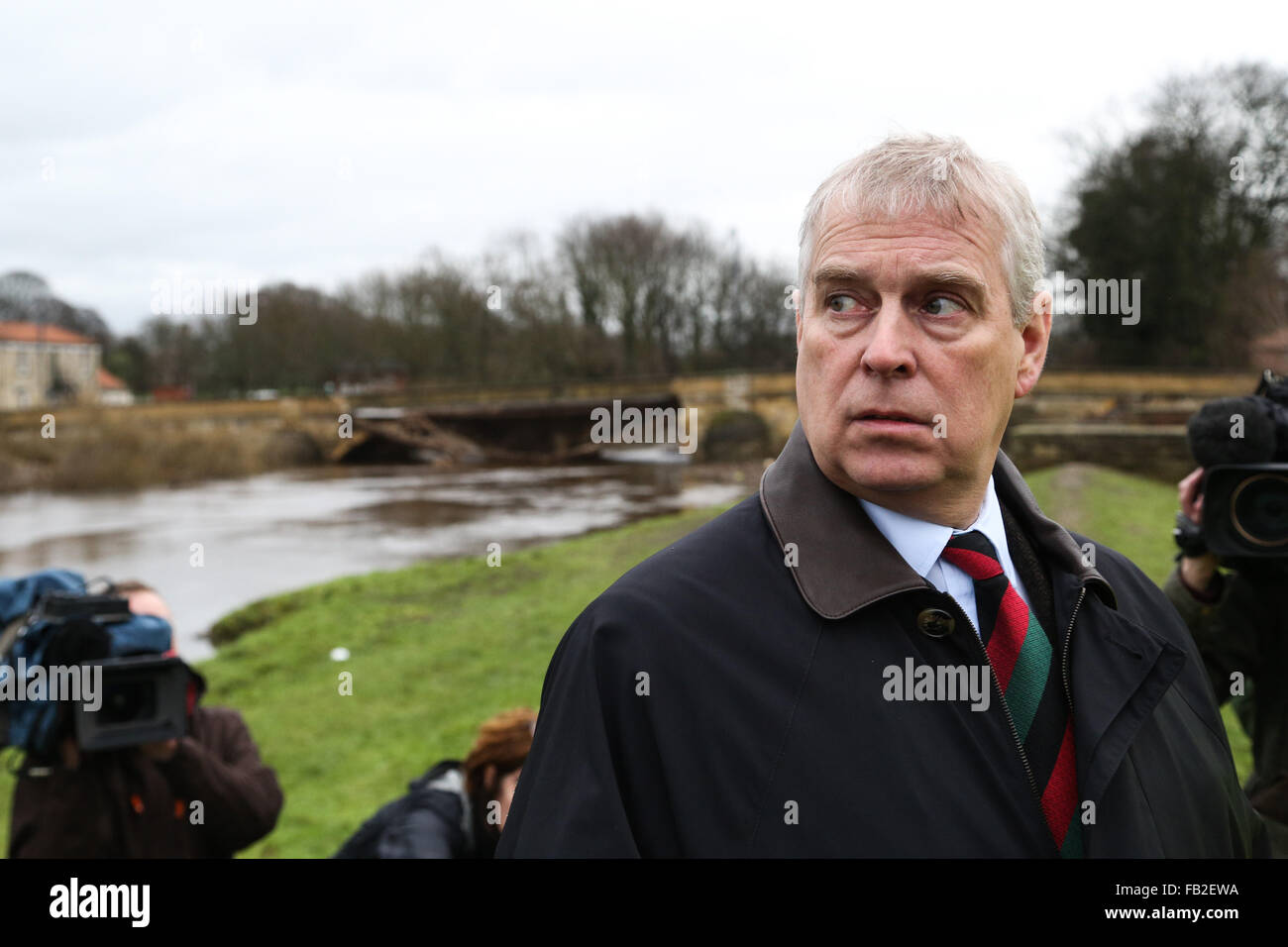 Prince Andrew, The Duke of York, in front of the damaged Tadcaster Bridge during his visit to the town of Tadcaster in North Yorkshire to see the damage caused by flooding in the last month. The town was heavily affected after the River Wharfe burst it's banks causing the bridge to partially collapse. Credit:  Ian Hinchliffe/Alamy Live News Stock Photo