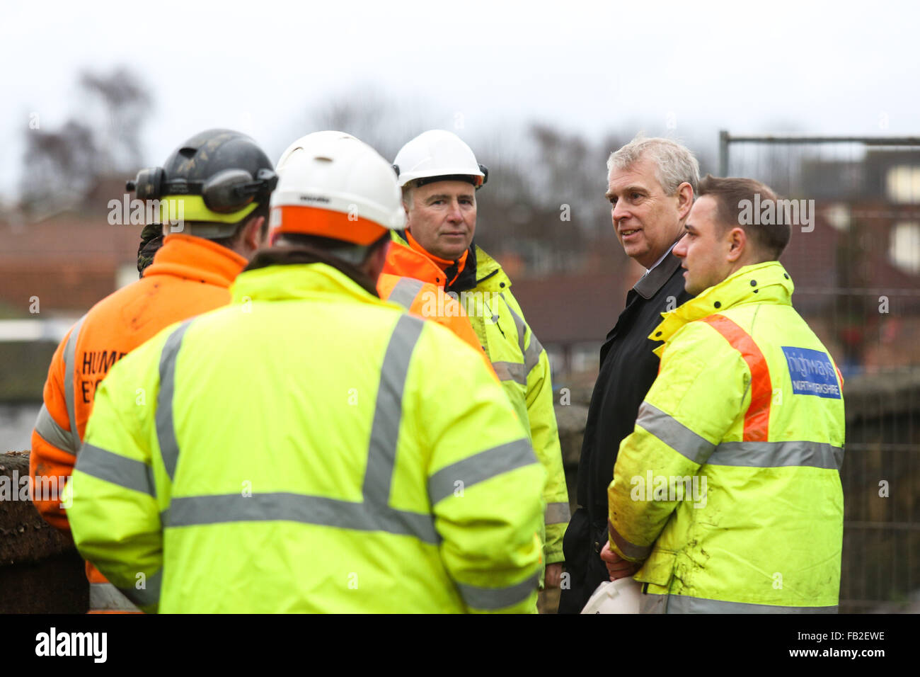 Prince Andrew, The Duke of York, talks to workers on Tadcaster Bridge during a visit to the town of Tadcaster in North Yorkshire to see the damage caused by flooding in the last month. The town was heavily affected after the River Wharfe burst it's banks causing the bridge to partially collapse. Credit:  Ian Hinchliffe/Alamy Live News Stock Photo