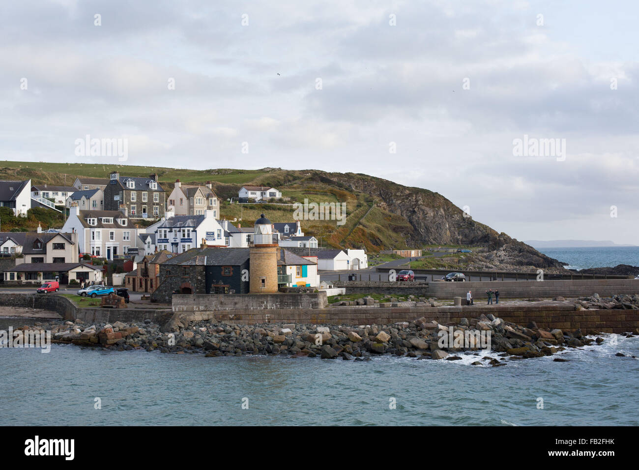 The late afternoon sunshine hits the coastline at Portpatrick in Dumfries and Galloway, Scotland, Britain. Stock Photo