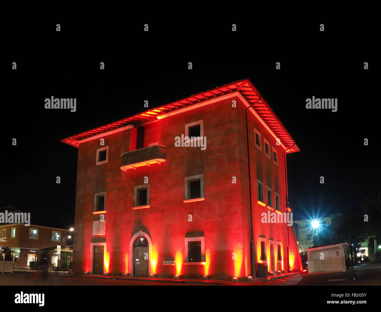 Fortino the symbol of Forte dei Marmi by night enlightened with red light  in christmas Holidays Stock Photo - Alamy