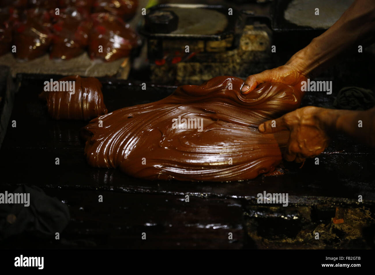 Lalitpur, Nepal. 8th Jan, 2016. Hands of Arjun Maharjan a thirty four