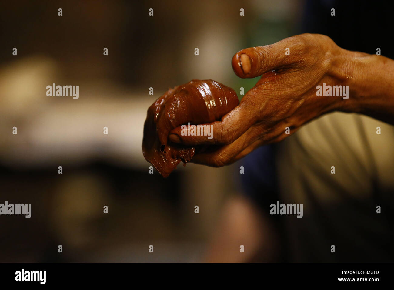 Lalitpur, Nepal. 8th Jan, 2016. Hands of Arjun Maharjan is seen holding