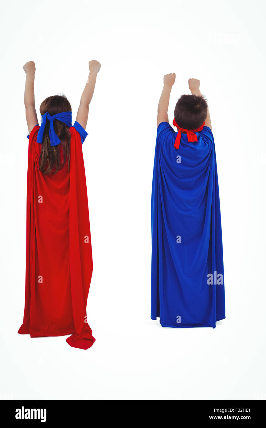 Masked kids pretending to be superheroes Stock Photo