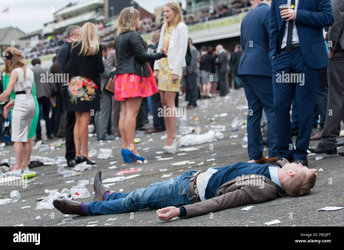 Ladies Day was too much for one racegoer at the Grand National 2014. Stock Photo