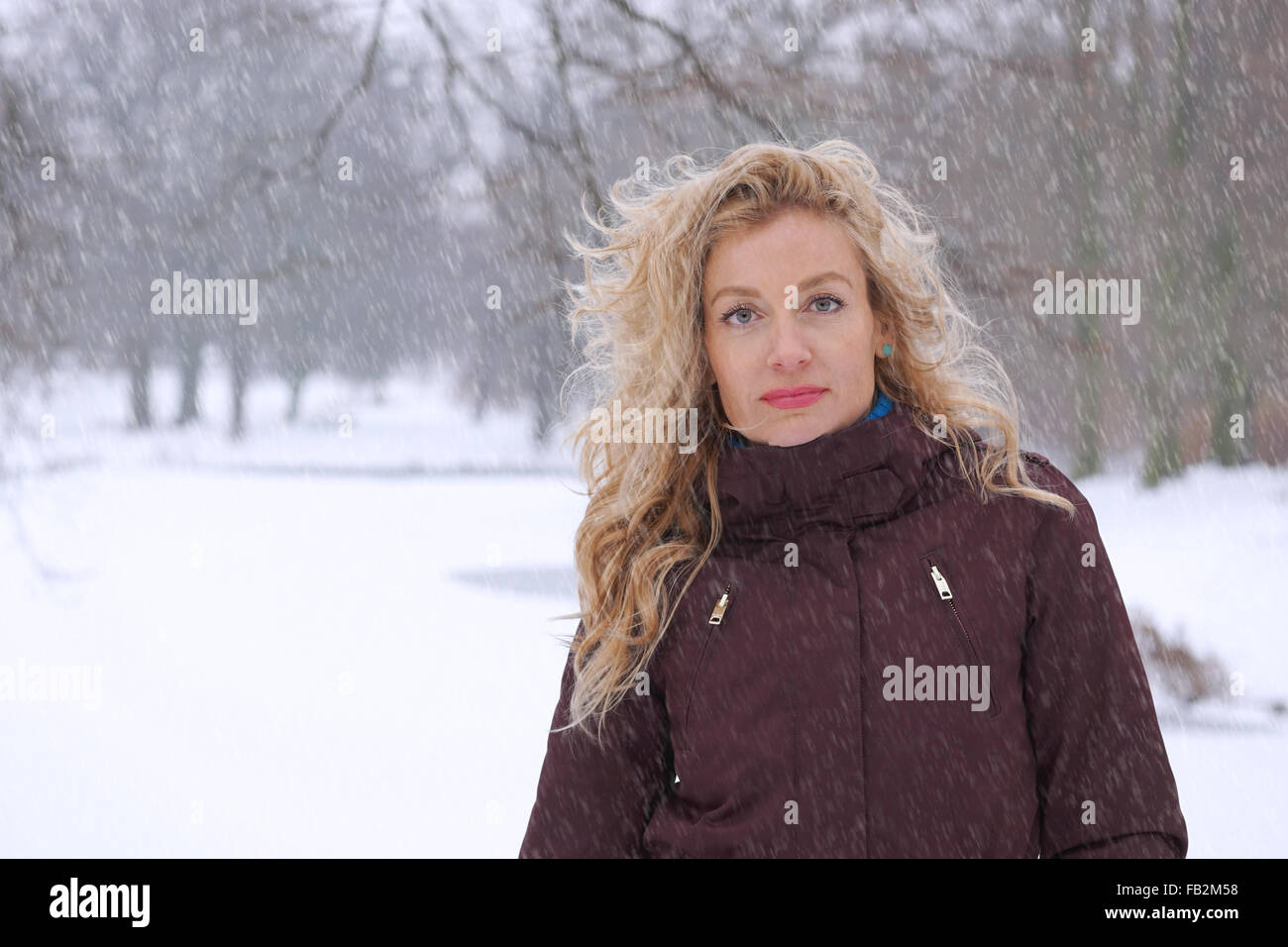 woman in heavy snowfall Stock Photo