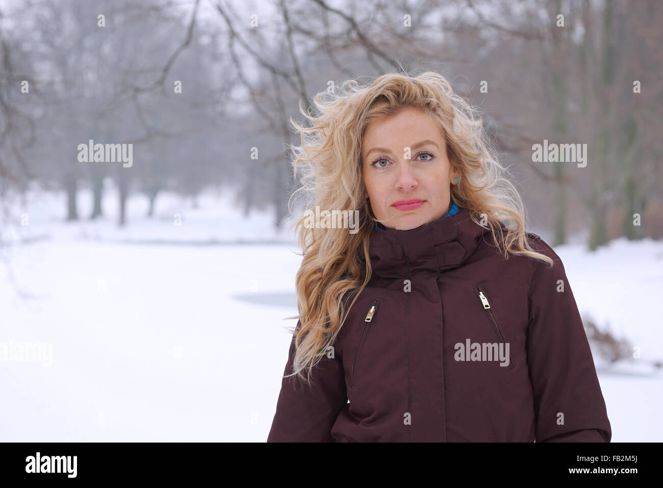 blond woman in winter landscape Stock Photo