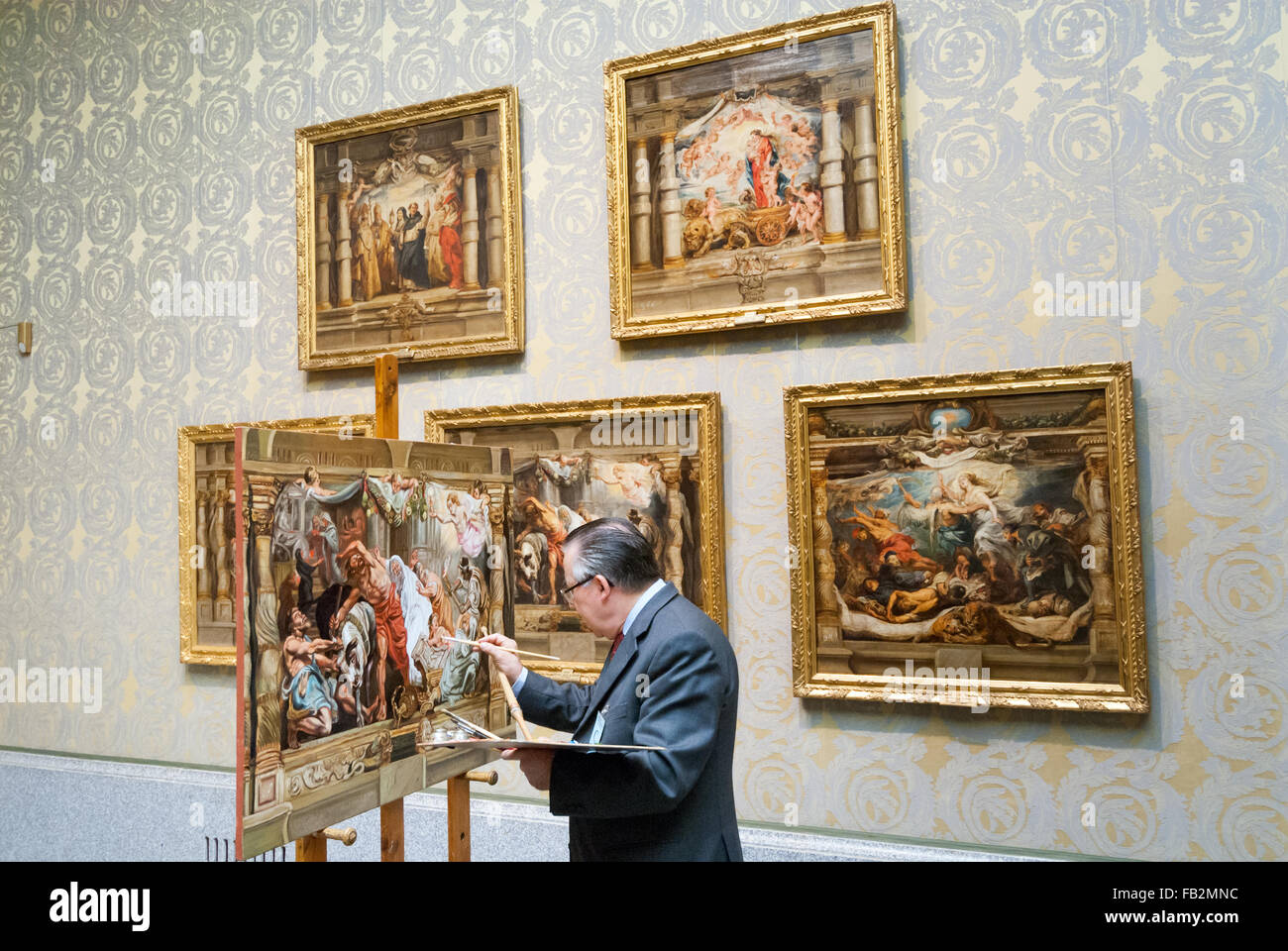 Artist copying old master oil painting in the Museo del Prado, Madrid, Spain Stock Photo