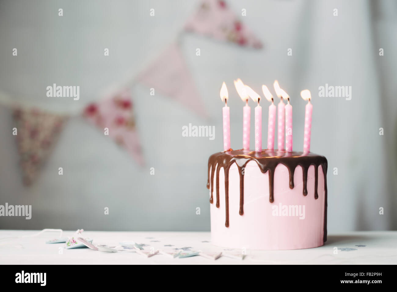 Birthday cake with pink candles Stock Photo - Alamy