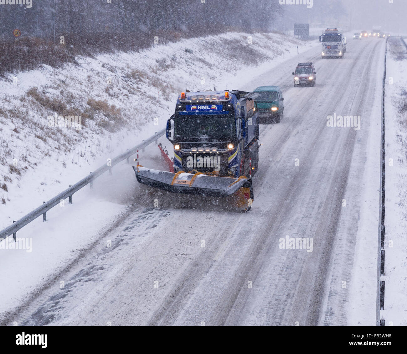 Sweden Weather: E20, Floda, Sweden, 8th Feb 2016. First major snowfall of the year causes traffic accidents and widespread travel disruptions. Snowplows and gritters are deployed to keep E20 motorway open.  Model Release: No.  Property Release: No. Stock Photo