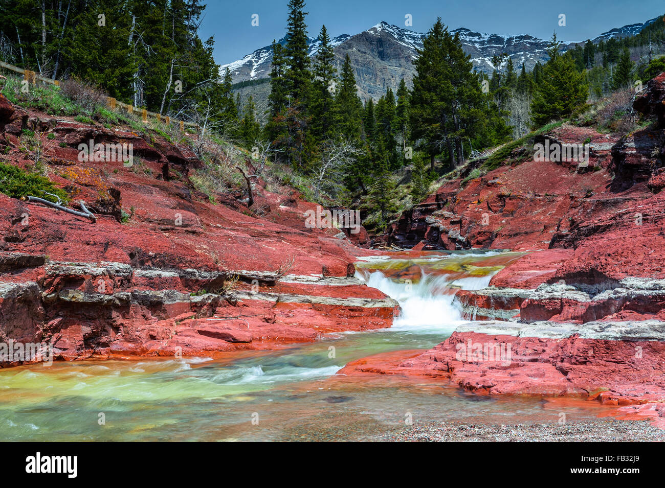 Red Rock creek With Vimy Peak and woodlands in background in Waterton