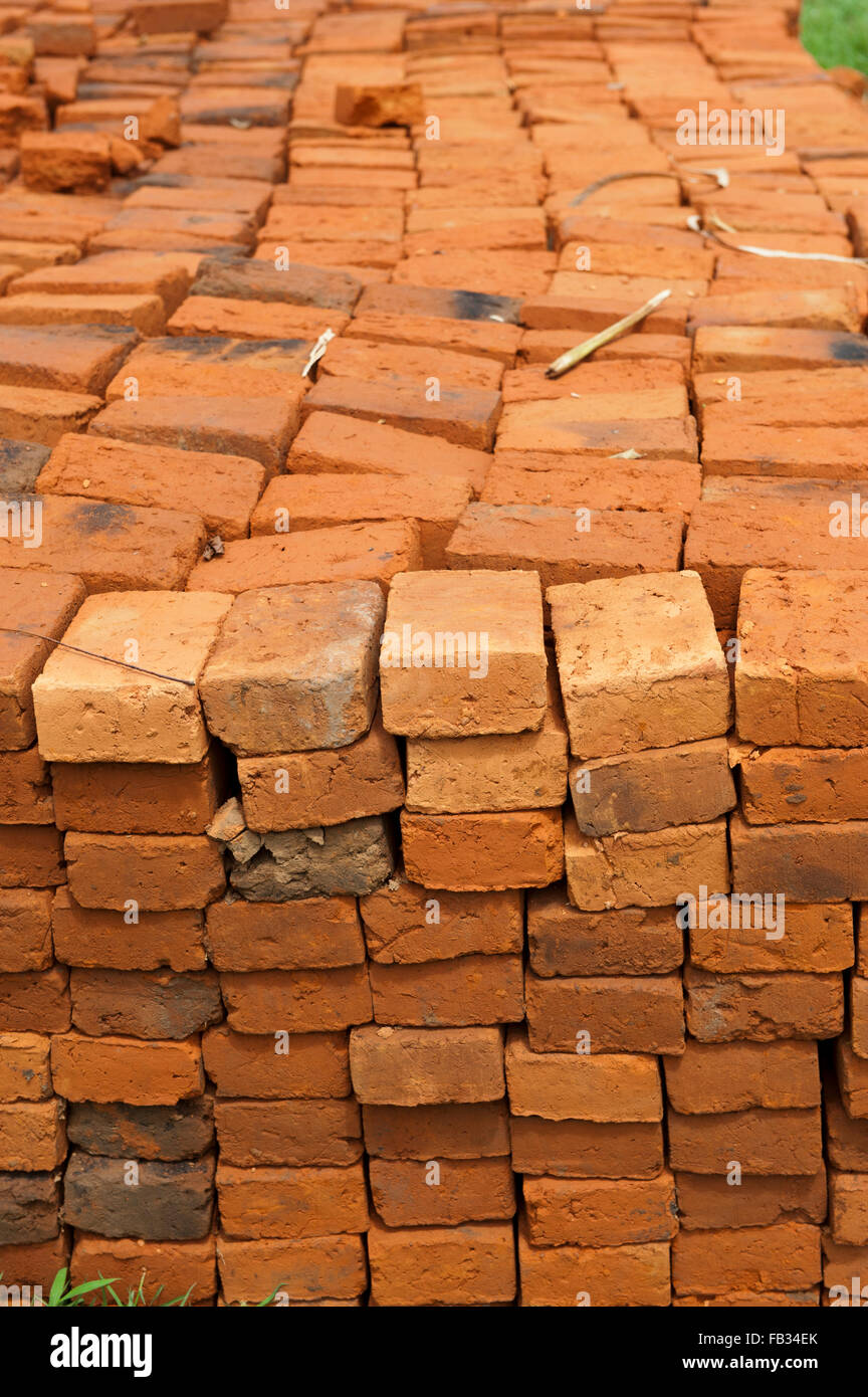 Sun dried bricks stacked and ready for use. Kenya. Stock Photo