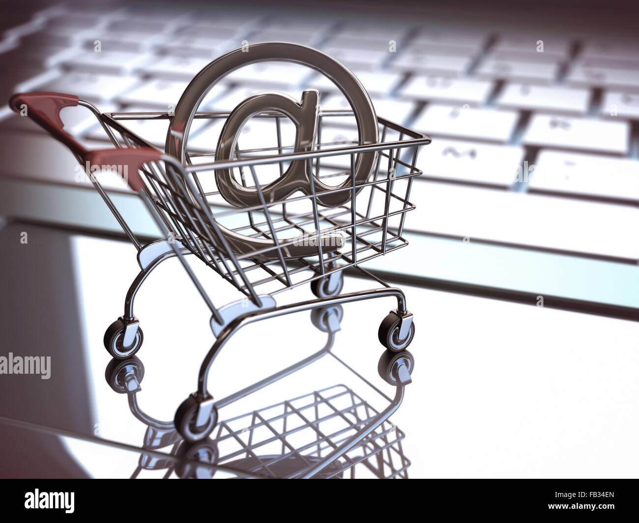 At sign, inside of the shopping cart on a laptop. E commerce concept. Depth of field with focus on At sign. Stock Photo