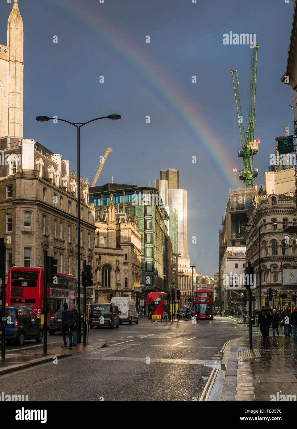 London, UK. 8th January, 2015. A Rainbow appears over The City of London today bringing some welcome sunshine to an otherwise dull day. Credit:  Lenscap/Alamy Live News Stock Photo