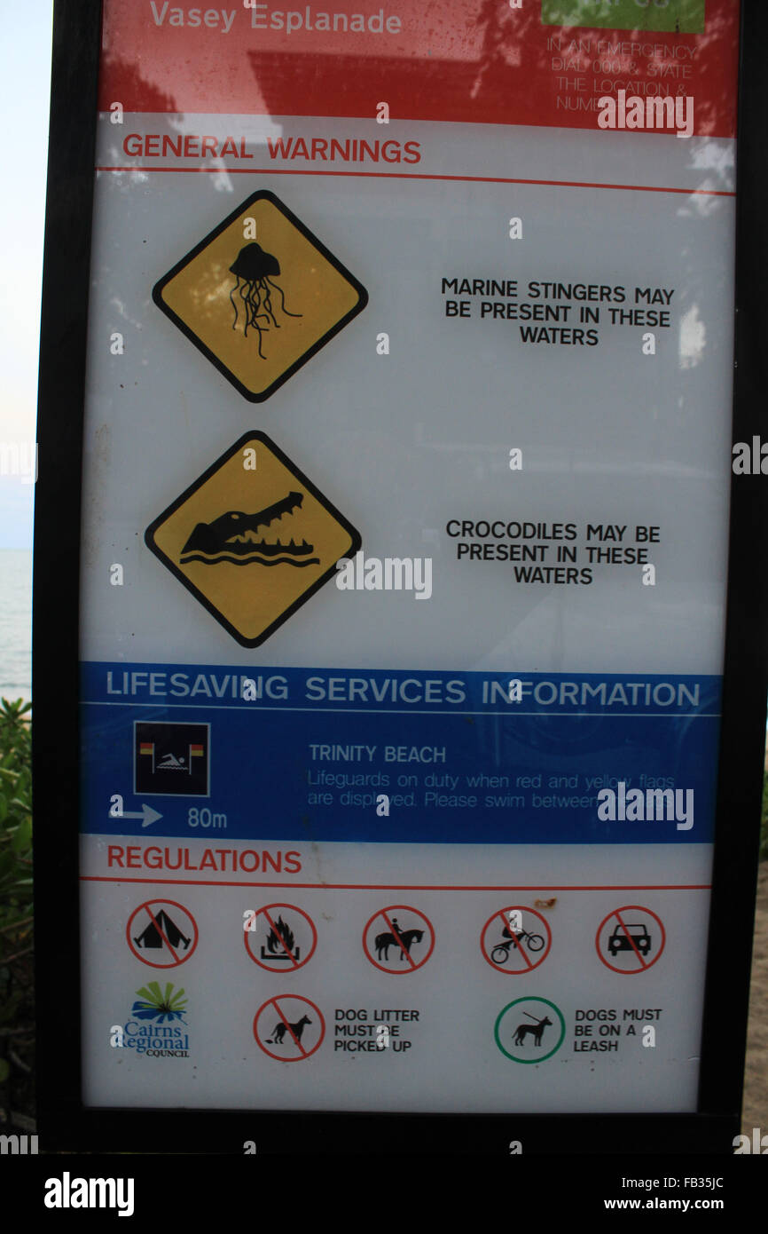 Crocodile and Marine Stingers warning sign, Trinity Beach, Cairns, Australia Stock Photo
