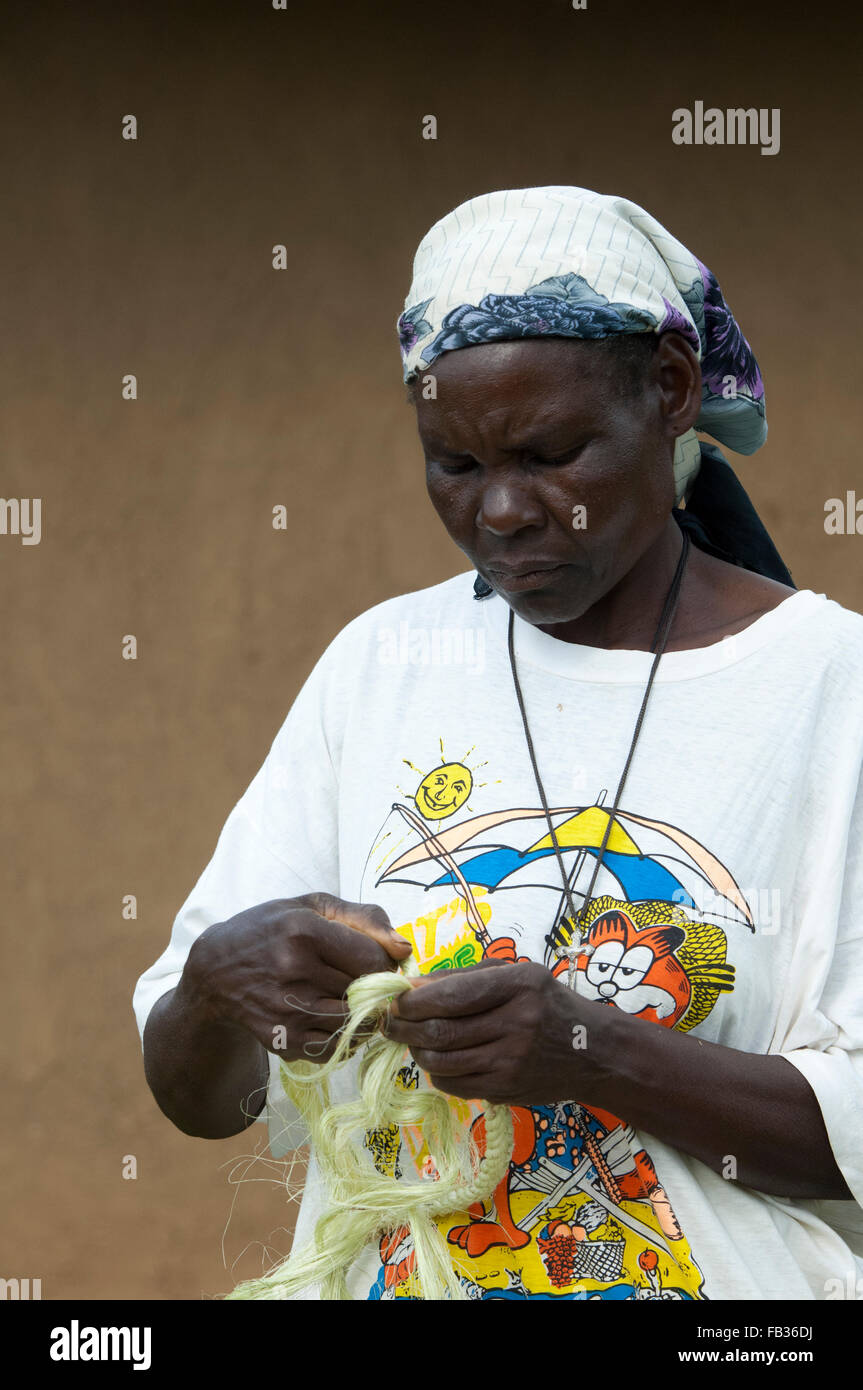 Kenyan lady plaiting sisal twine to make a rope. Kenya Stock Photo Alamy